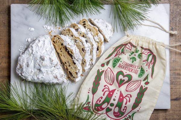 Loaf of Zingerman's stollen bread next to its printed muslin bag