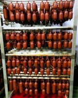 Rows and rows of nduja hanging to cure at Nduja Artisans in Chicago