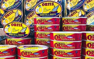 Stacked tins of Ortiz tuna