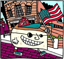 Cartoon wedge of cheese wearing a USA hat and holding an American flag in front of Zingerman's Deli